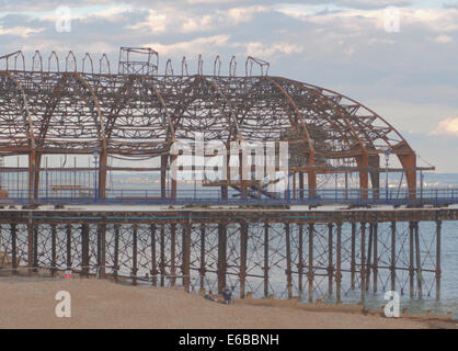 Eastbourne, East Sussex, UK. 19th August, 2014. A workman has died whilst working on Eastbournes fire damaged pier structure. This tragedy comes after the fire with no injuries and a successful Airbourne Event.. Very sad indeed.. Credit:  David Burr/Alamy Live News Stock Photo