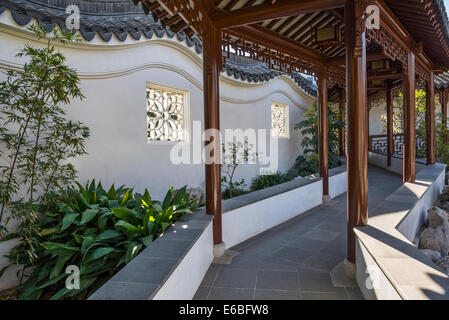 Beautiful covered walkway in the Chinese Gardens of the Huntington Library and Botanical Gardens. Stock Photo