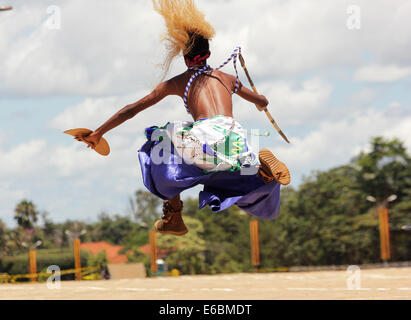 A member of the Burundi cultural troupe entertains guests in Kampala, Uganda Stock Photo