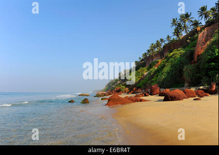 Red cliffs on the beach in Varkala, Kerala, South India, India Stock Photo