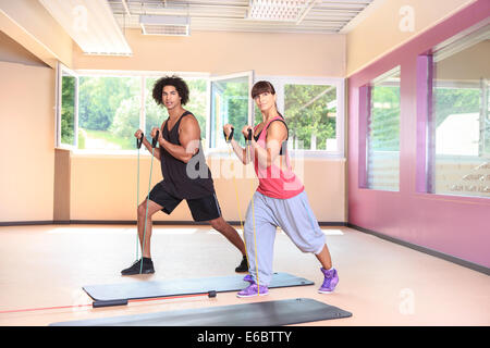 young people with rubber strap in a gym Stock Photo