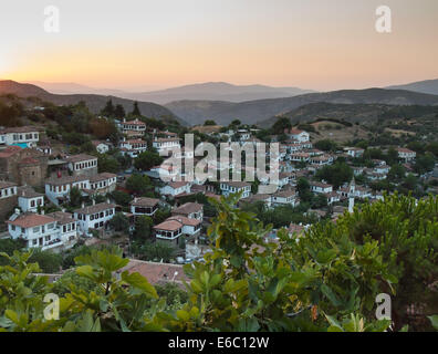 view over  the turkish village of sirince in izmir province at sunset with fig tree in forground Stock Photo