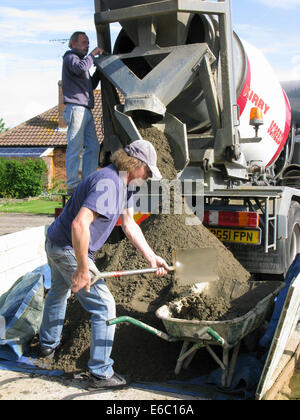 Lorry delivering concrete & cement for use in a home extension Stock Photo