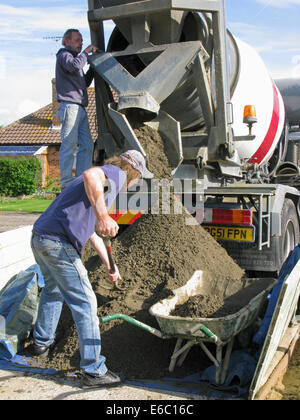 Lorry delivering concrete & cement for use in a home extension Stock Photo