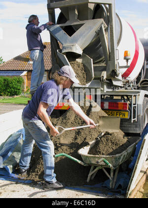 Lorry delivering concrete & cement for use in a home extension Stock Photo