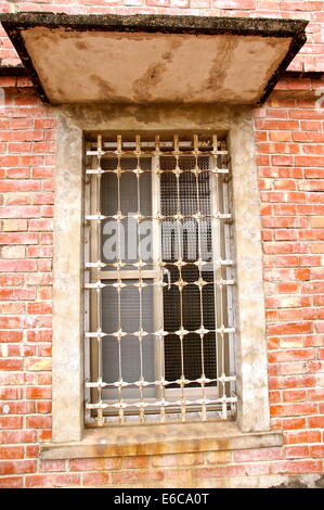 The closeup of window with iron bar grill Stock Photo