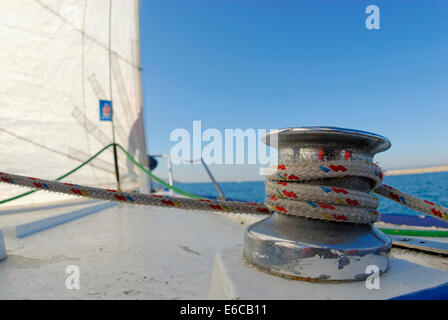 Rope on sail trim (winch) and sails of a yacht in the Mediterranean Sea, France, Europe Stock Photo