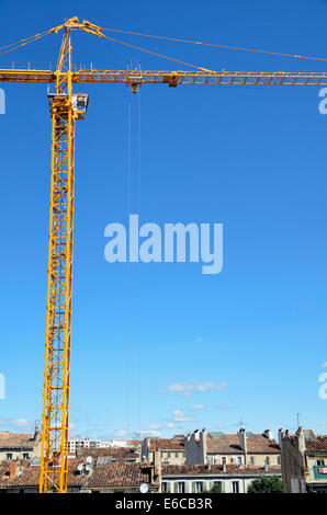 Tall crane on a construction site, building site Stock Photo