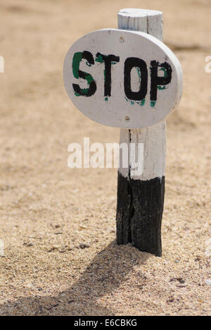 Stop sign on sand, No human allowed for fauna and flora preservation purposes, North Seymour Island, Galapagos Islands, Ecuador Stock Photo