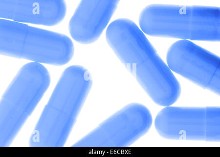 Blue capsules isolated over white background Stock Photo