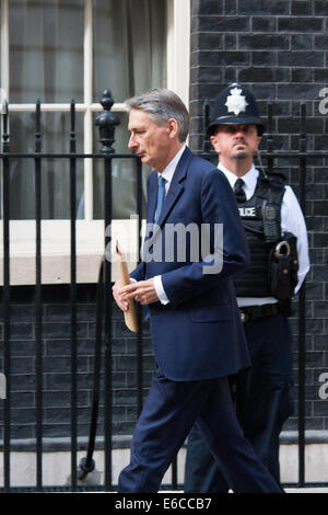 London, UK. 20th Aug, 2014. Foreign Secretary Philip Hammond leaves number 10 Downing street following a meeting with Prime Minister David Cameron, who flew back from his holiday, to chair a meeting relating to the escalation in the crisis with Jihadists of the Islamic State, who executed hostage American journalist James Foley. It is understood that his killer could be British. Credit:  Paul Davey/Alamy Live News Stock Photo