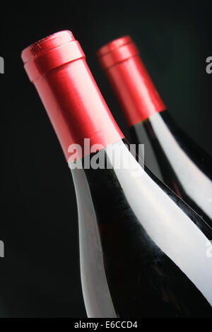 Two corked wine bottles over black background Stock Photo