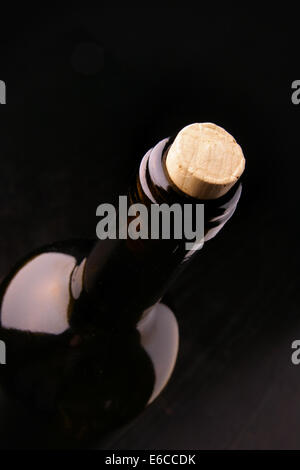 Neck of the bottle with corck over black background Stock Photo