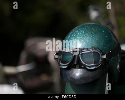 Green retro crash helmet with goggles Stock Photo