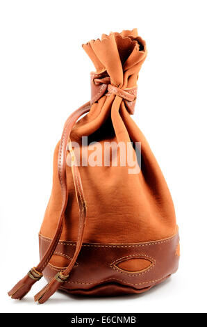 brown suede pouch on white background, vertical Stock Photo