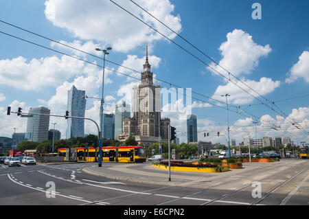 Yellow tram near Palace of Culture and Science in the center centre of Warsaw, Poland Stock Photo