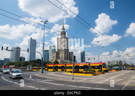 Yellow tram near Palace of Culture and Science in the center centre of Warsaw, Poland Stock Photo