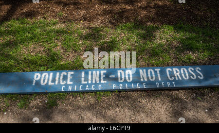 A Police Line- Do Not Cross sign found in a park in downtown Chicago. Stock Photo