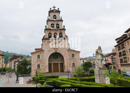CANGAS DE ONIS, SPAIN - JULY 16, 2014: Church tower and statue of Pelayo, first king of Spain, in Cangas de Onis, Asturias. Stock Photo