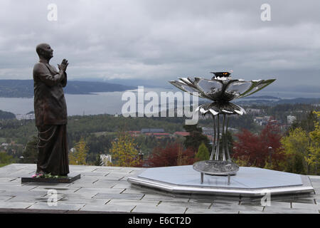 Statue of Sri Chinmoy and Eternal Peace Flame above the city of Oslo at Holmenkollen Stock Photo