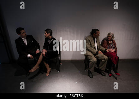 Buenos Aires, Argentina. 20th Aug, 2014. Two couple prepare to participate during the qualifying rounds of the World of Tango in the form of 'Scenario', in Buenos Aires city, Argentina, on Aug. 20, 2014. The qualifying rounds of the World of Tango have a total of 574 registered couples from 37 countries worldwide. Credit:  Martin Zabala/Xinhua/Alamy Live News Stock Photo