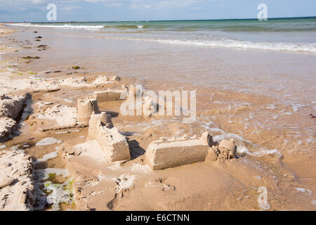 sand castle being washed away Stock Photo - Alamy