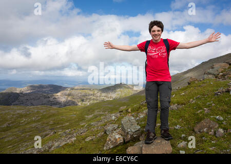 A teenage boy climbing Ben More, a Munro on the Isle of Mull, Scotland, UK. Stock Photo