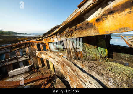 An old fishing boat run aground at Salen on the Isle of Mull, Scotland, UK. Stock Photo