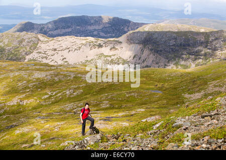 A teenager climbing the Munro on Ben More, Isle of Mull, Scotland, UK. Stock Photo