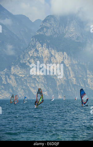 Windsurfers on Lake Garda near Torbole, Lago di Garda, Torbole, Nago, Italy, Europe, Windsurfing, aquatic sport , Alps mountains Stock Photo