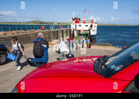 Passengers disembarking the Iona ferry at Fionnphort Isle of Mull, Scotland, UK, looking towards Iona. Stock Photo