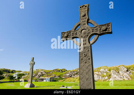 St john's Cross in the grounds of Iona Abbey, Iona, off mull, Scotland, UK, with St Oran's Cross in the background Stock Photo