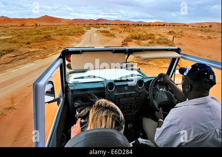 In Safari car on the dunes of the Sossusvlei, Namibia Stock Photo