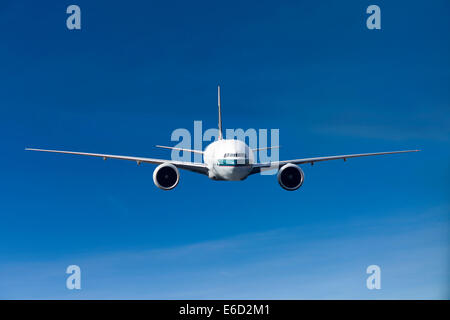 Cathay Pacific Boeing 777-367 ER in flight Stock Photo