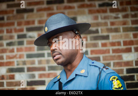 Ferguson, Mo. 20th Aug, 2014. Capt. Ron Johnson of the Missouri State Highway Patrol speaks to members of the media after speaking with United States Attorney General Eric Holder at Drake's Place Restaurant, Wednesday, Aug. 20, 2014, in Ferguson, Mo. Holder arrived in Missouri on Wednesday, as a small group of protesters gathered outside the building where a grand jury could begin hearing evidence to determine whether a Ferguson police officer who shot 18-year-old Michael Brown should be charged in his death. Credit:  dpa picture alliance/Alamy Live News Stock Photo