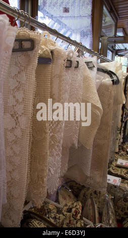 Traditional embroidery and lace items for sale in a specialist lace shop in Bruges, Belgium. Stock Photo