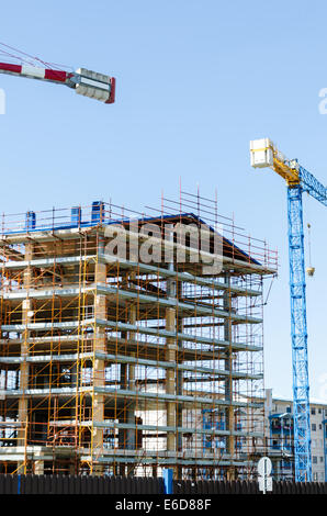 House exterior in construction and crane Stock Photo