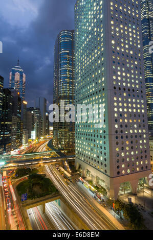 Busy traffic in front of Jardine House, the Jardine Matheson building, seen from the Mandarin Oriental Hotel, Hong Kong, China Stock Photo