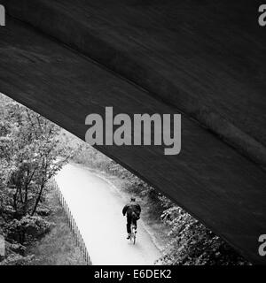 Man riding a bicycle on bike path Stock Photo
