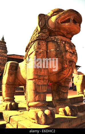Statue image Lion guarding at Bhaktapur Durbar Square is an ancient Newar city in the east corner of the Kathmandu Valley, Nepal Stock Photo