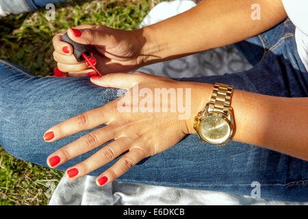 A young girl painting nails, Prague, Czech Republic Stock Photo