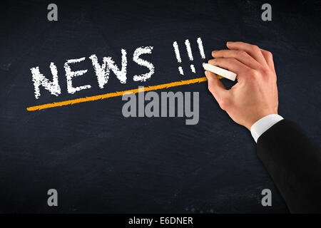 chalkboard with hand and NEWS drawing Stock Photo