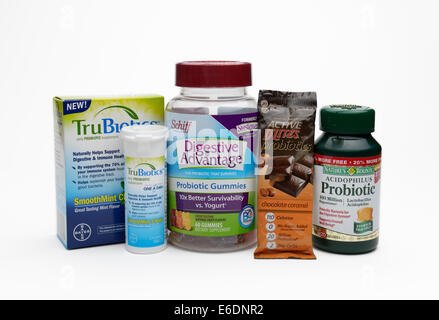 Variety of probiotic supplements including pills, chewable tablets, gummies and chocolate Stock Photo