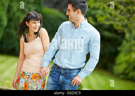 Happy couple walking outdoors Stock Photo