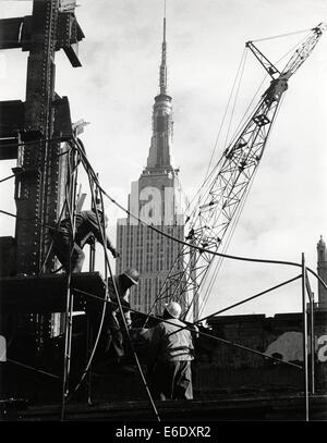 Demolition Workers Removing Remains of Pennsylvania Station with Empire State Building in Background, New York City, USA, 1966 Stock Photo