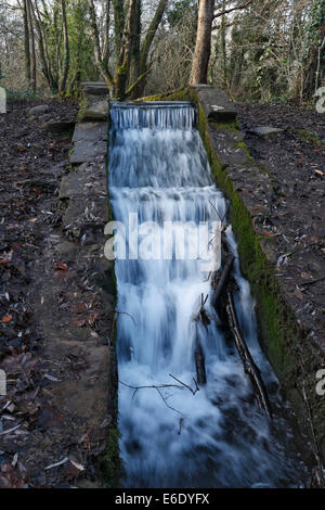 Waterfall overflow on the Glamorganshire canal in Forest farm in Cardiff, Wales UK Stock Photo