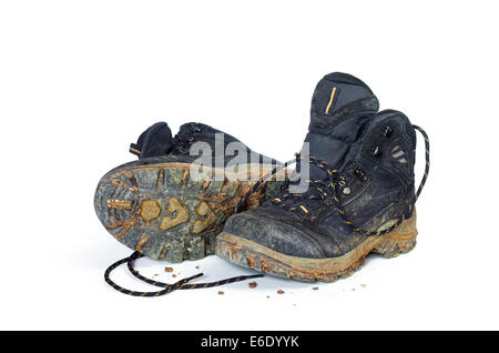 A pair of dirty hiking boots isolated in white background Stock Photo