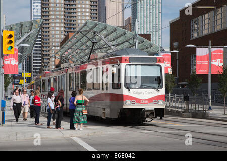 Calgary CTrain powered by wind energy. Downtown station, with passengers on sidewalk. Canada. Stock Photo