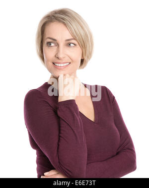 Isolated smiling middle aged woman in fall clothes looking sideways to text. Stock Photo
