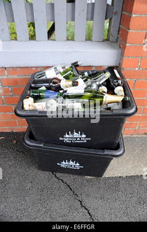 Brighton UK - Recycling boxes full of empty glass bottles for collection by Brighton and Hove City Council Stock Photo